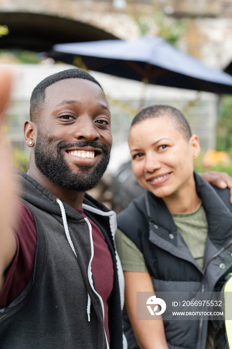 Portrait of smiling couple in allotment