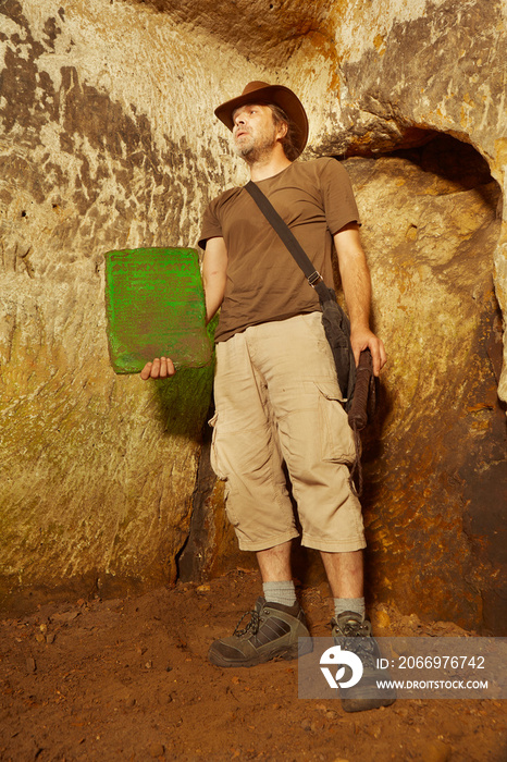 Adventurer in ancient cave finally found mysterious artifact emerald tablet