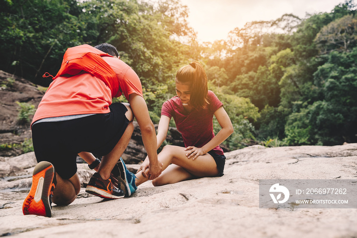 Runners. Young people  trail running on a mountain path. Adventure trail running on a mountain. Runners receive injuries from running trails on a mountain