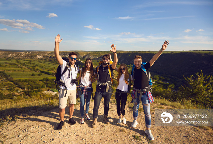 Adventure, male and female hikers climbing up mountain. Success full at top mountain.