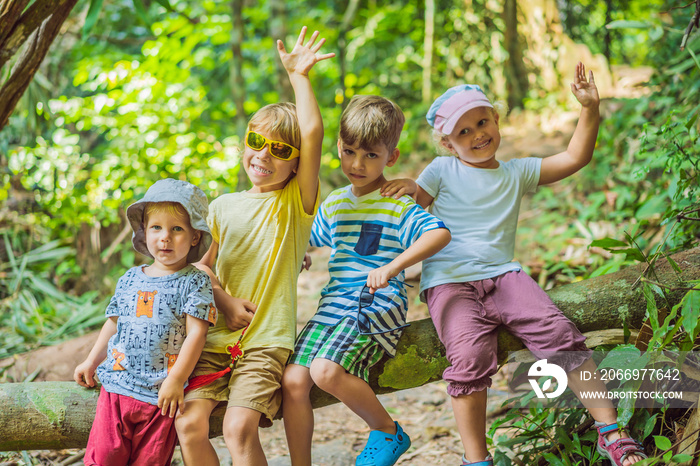 Children rest during a hike in the woods