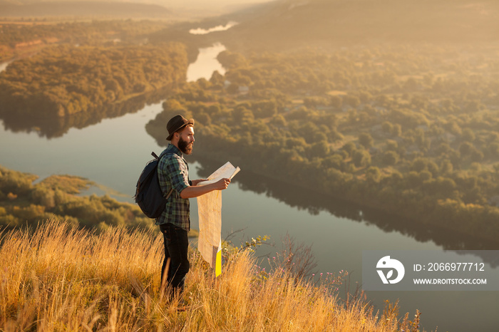 Bearded tourist with map