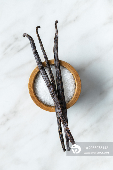 Vanilla pods. Sticks of vanilla and white sugar in bowl