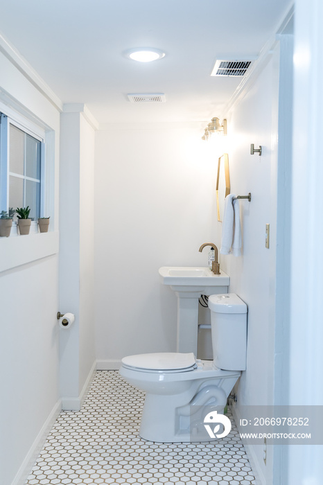 A small toilet and sink area