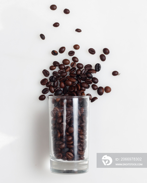 Coffee beans on a bright white background. This is an arabica coffee bean. The distinctive taste of Arabica coffee is in the form of a light consistency and a higher acidity level than other coffees.