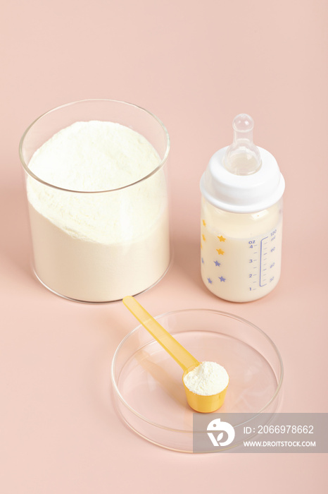 Preparation of formula for baby feeding. Baby health care, organic mixture of dry milk concept.