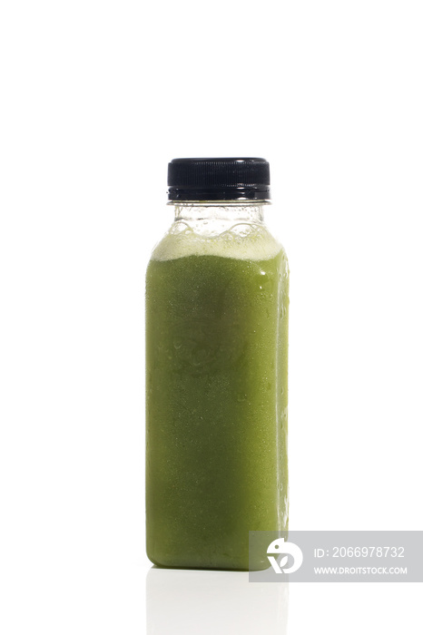 Fresh vegetable detox juice on plastic bottle over a white background