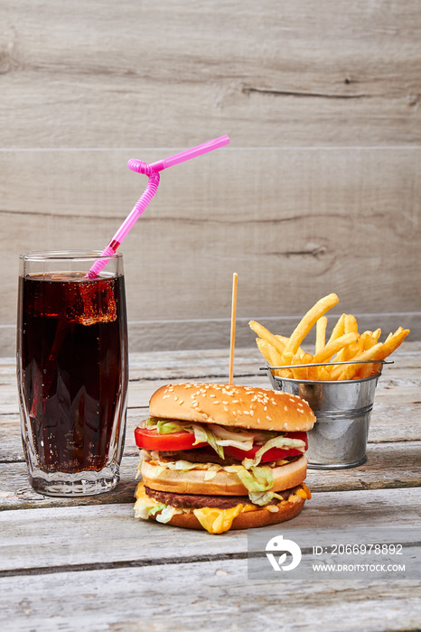 Fries bucket and cola drink.