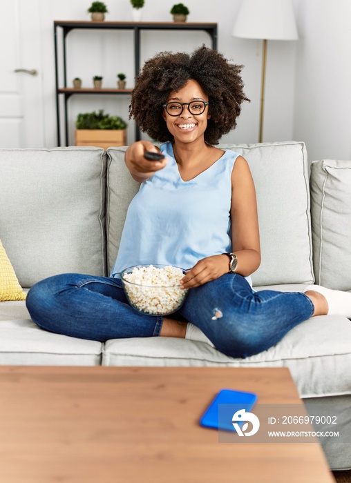 Young african american woman smiling confident watching movie at home