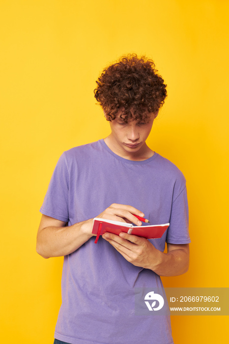 cute red-haired guy notepad with pen learning emotions yellow background unaltered