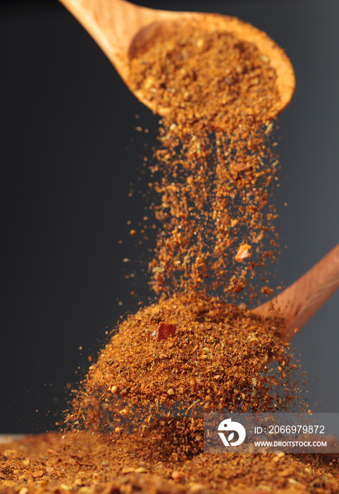 Wooden spoons with mixture of different  spices