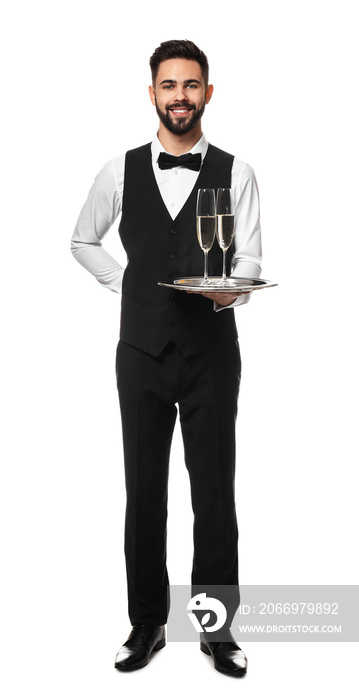 Handsome waiter with glasses of champagne on white background