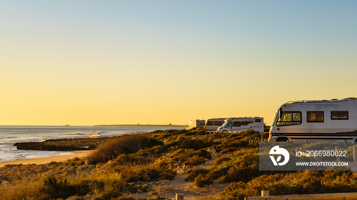 Camper cars on beach sea shore