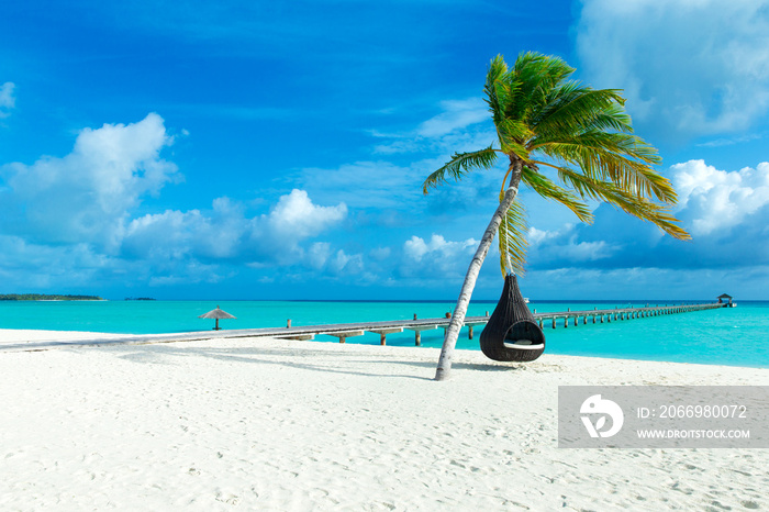 tropical Maldives island with white sandy beach and sea