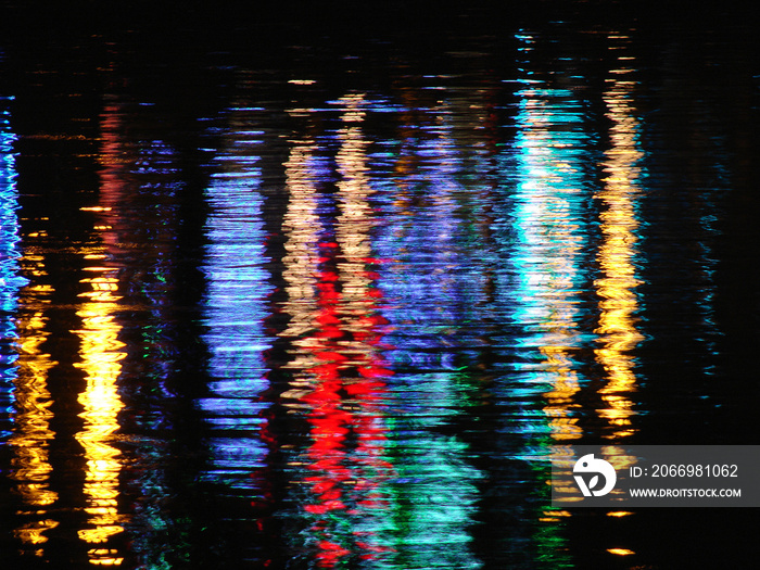 Lights reflecting in rippled water surface