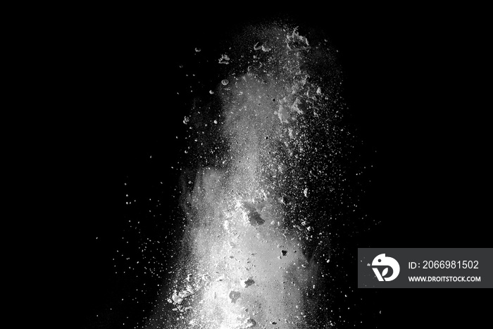 Explosion of white dust on black background.