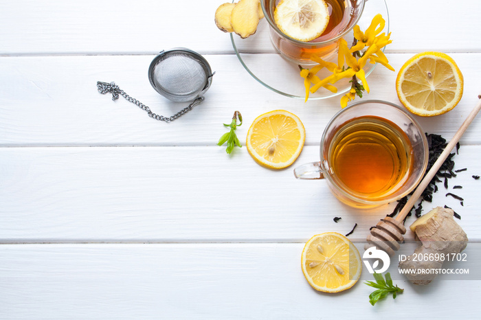 Tea with lemon on a white wooden table