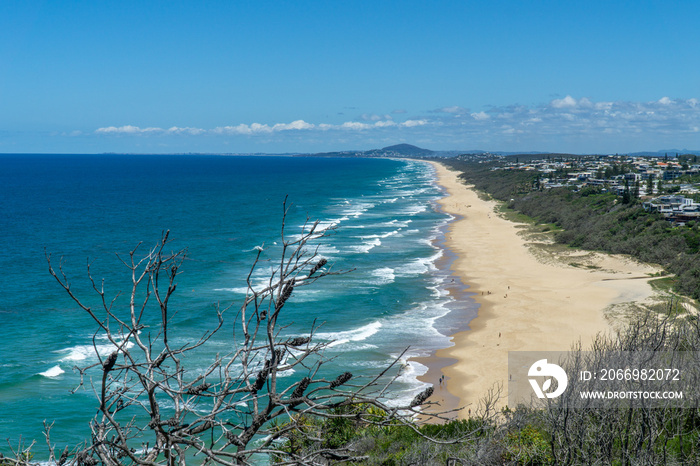 the beautiful beach of Noosa on the sunshine coast in Australia with beautiful weather and blue sky with white clouds