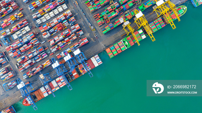 Container ship loading and unloading in deep sea port, Aerial top view of business logistic import and  export freight  transportation by container ship in open sea.