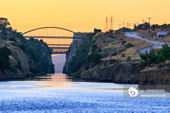 The Corinth Canal transport corridor between two seas in Greece in the early morning haze.