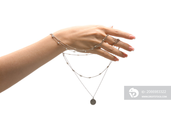 Female hand with stylish necklace on white background