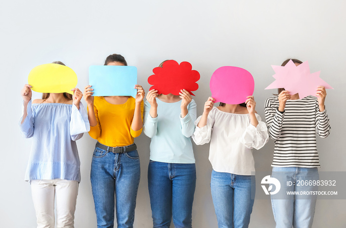 Women with speech bubbles on white background