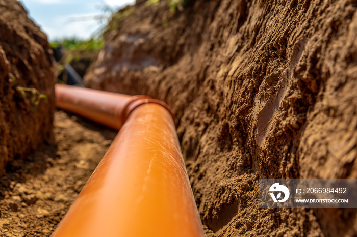 plastic pipes in the ground for wastewater and rainwater