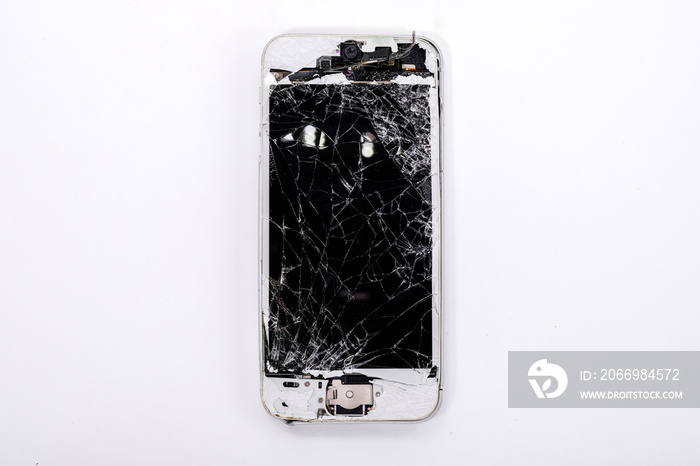 Studio shot of broken Smartphone with seriously broken retina Phone display screen Isolated on white