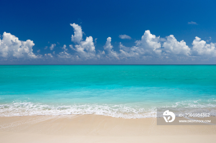 tropical Maldives island with white sandy beach and sea