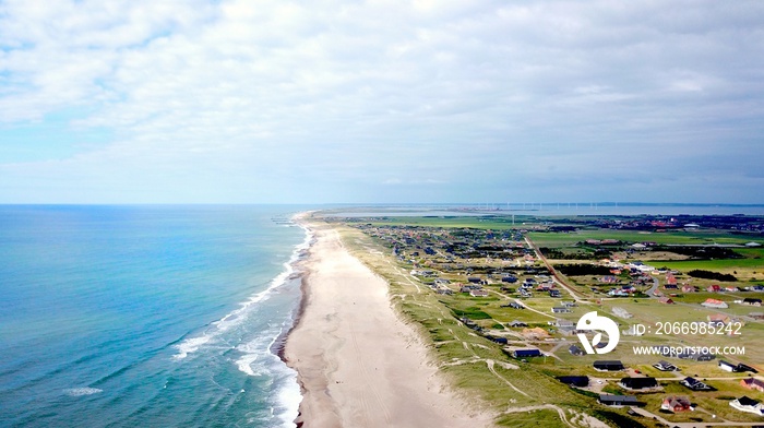 aerial view along the endless beaches on the coast of denmark and jutland, vrist with block towards thyboron and the limfjord in summer, Lemvig, Denmark