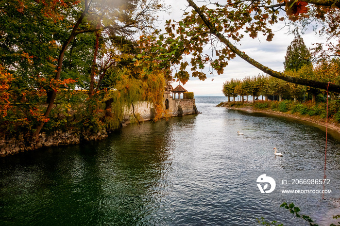 Bodensee channel and embankment with nice trees in public park, Konstanz, Germany.