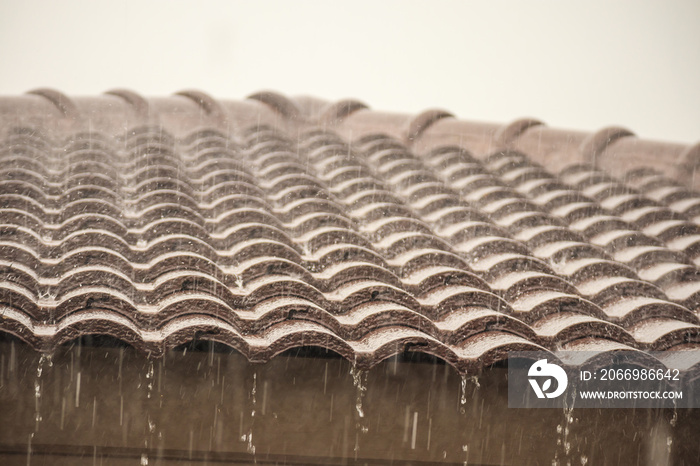 rain falling down from the house roof