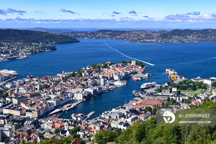 Aerial bird view of Bergen city and harbour with ferry entering the port