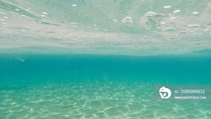 sand bottom underwater swimming in turquoise lagoon