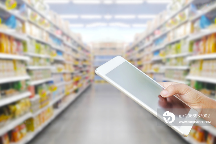 Woman checking shopping list on tablet