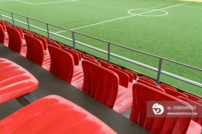 Empty rows with red  seats on a football stadium