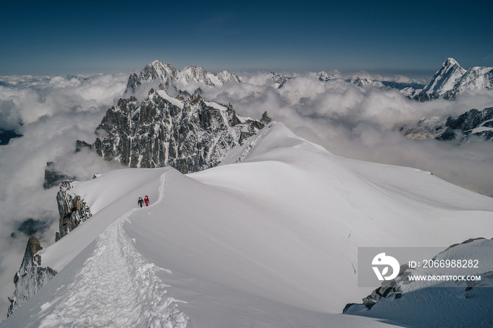 Alpine mountain landscape of Mont Blanc Masiff, Chamonix, France. Alpine peaks, Aiguille du Midi and other famous alpine mountains. Alpinism, climbing, glaciers and snow.