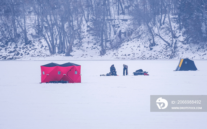 People are ice fishing on frozen Mississippi River