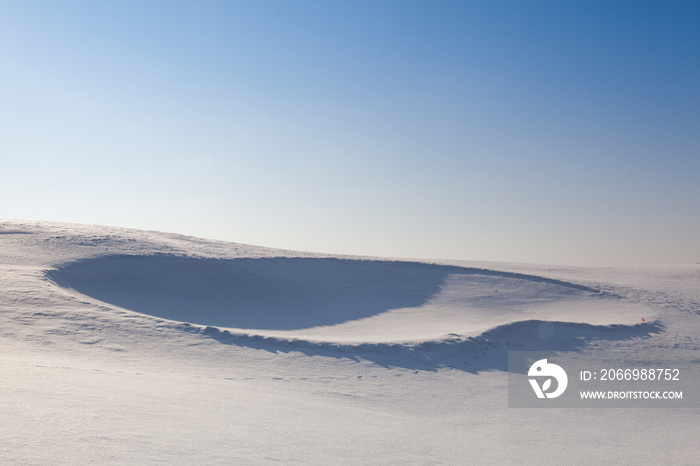 Golf bunker full of snow