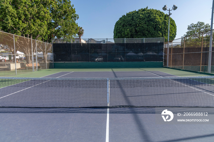 Empty tennis court in a Los Angeles city park.