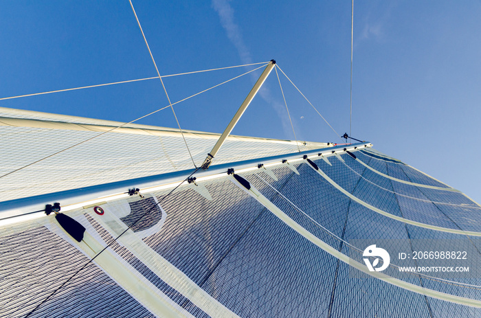 Sail of a Catamaran sailing boat against clear blue sky