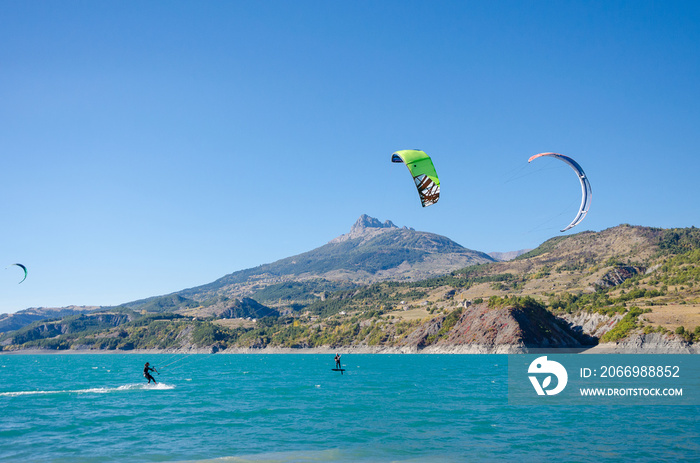 Kite hydrofoil and kite surfing on the lake of Serre Ponçon in Provence-Alpes-Côte d’Azur, France