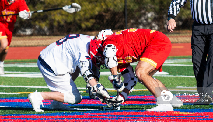 Lacrosse faceoff during high school boys game