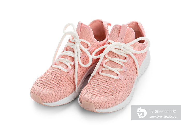 Pink shoes with laces on white background