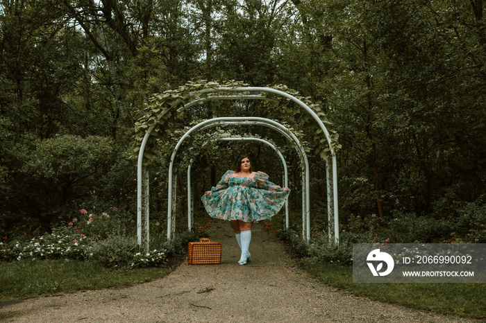 portrait of a plus size woman with a picnic basket