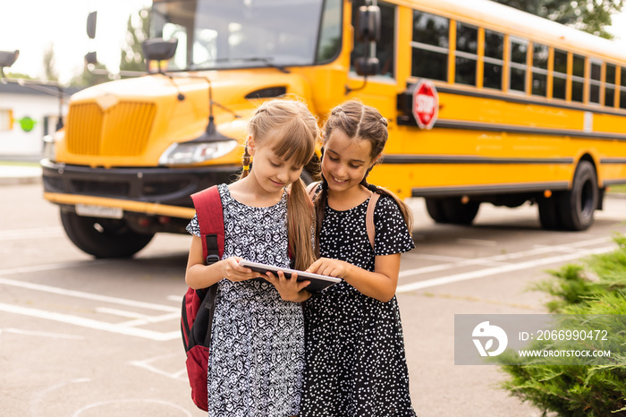 Two little kids going to school together