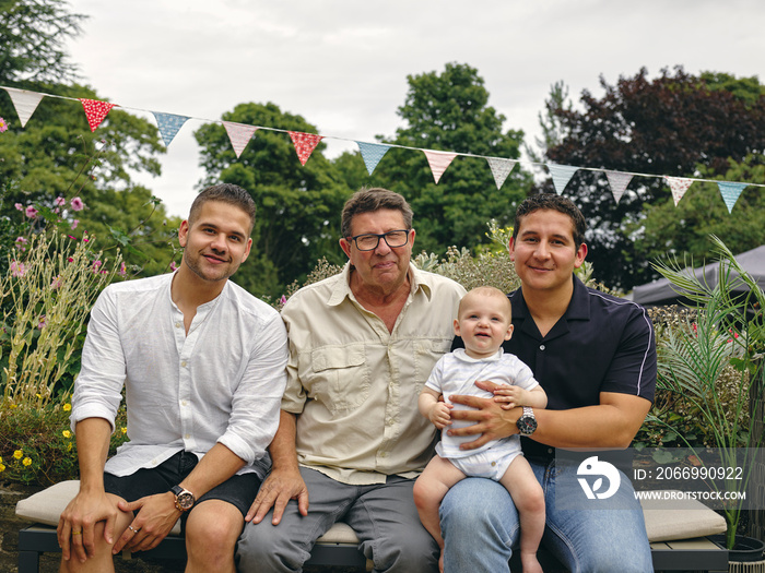 Portrait of father with sons and grandson