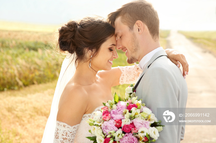 Happy beautiful couple on wedding day, outdoors