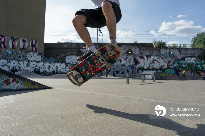 Young man skateboarding in skate park