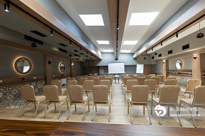 Interior of a empty hotel seminar room with chairs in a row